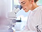 woman in front of a microscope | Protefix